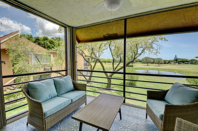 sunroom / solarium with a water view