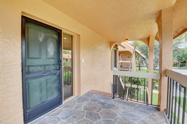 property entrance featuring stucco siding