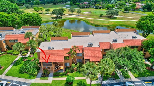 birds eye view of property featuring golf course view and a water view