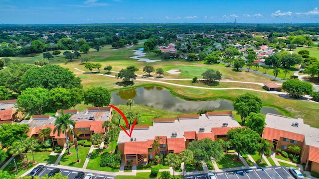 birds eye view of property featuring golf course view and a water view