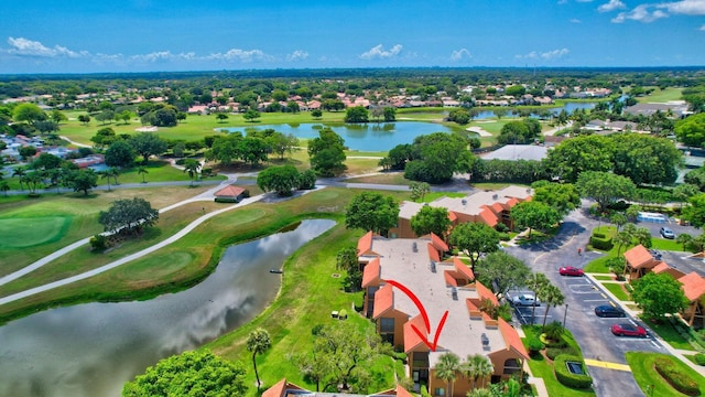 bird's eye view featuring a water view and golf course view