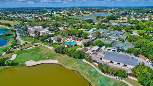 aerial view with a residential view, a water view, and golf course view