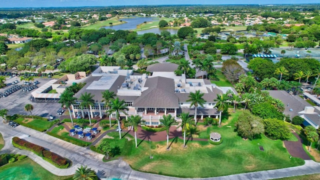 drone / aerial view with a residential view and a water view