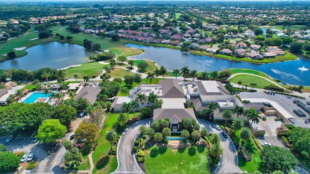 birds eye view of property with a residential view, view of golf course, and a water view