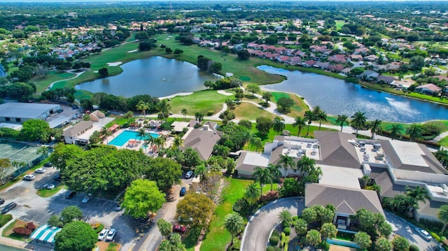 drone / aerial view featuring a residential view and a water view