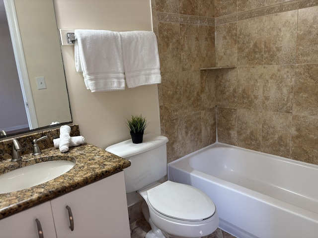 bathroom with toilet, vanity, and shower / tub combination