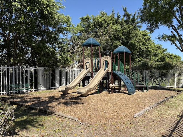 communal playground featuring fence