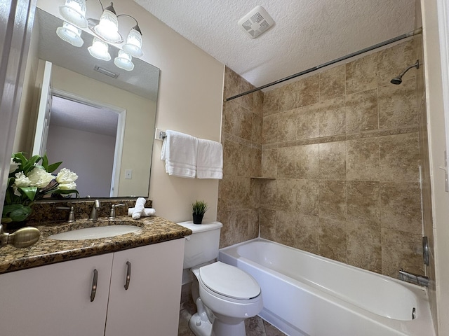 full bath with vanity, visible vents,  shower combination, a textured ceiling, and toilet