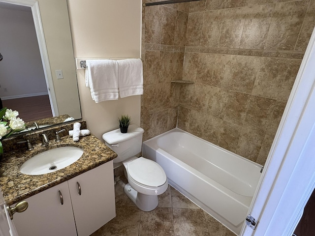 full bathroom featuring bathing tub / shower combination, toilet, vanity, and tile patterned flooring