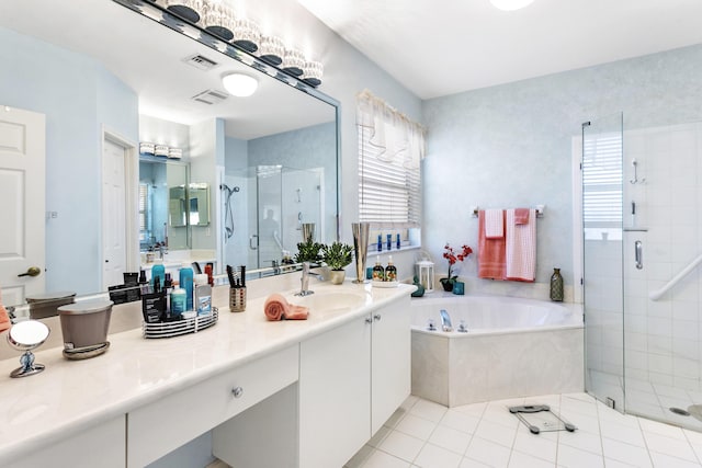 bathroom with a wealth of natural light, a stall shower, a bath, and vanity