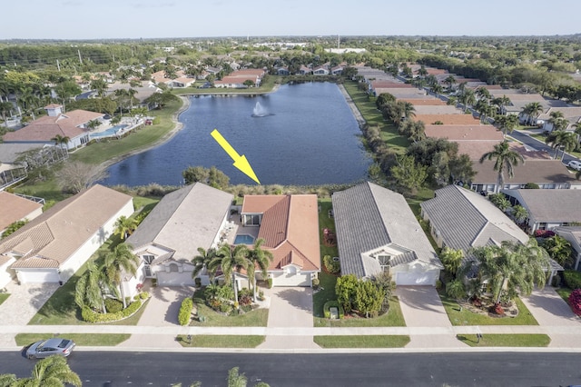 aerial view featuring a residential view and a water view