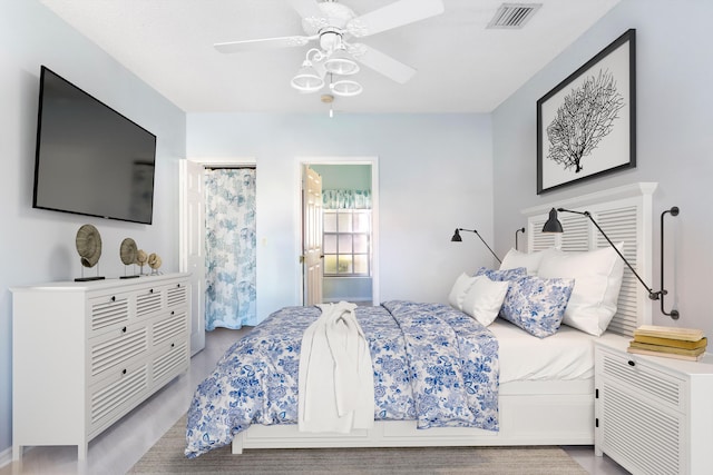 bedroom with visible vents and a ceiling fan