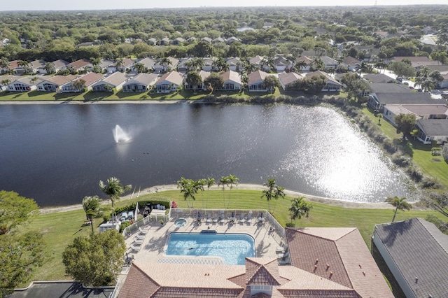 birds eye view of property with a residential view and a water view