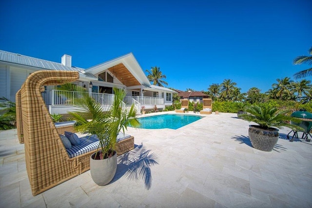 outdoor pool featuring a patio area