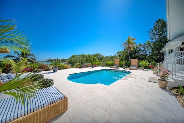 view of pool with a fenced in pool and a patio