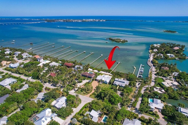 bird's eye view with a water view and a residential view