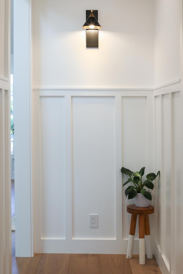 room details with a wainscoted wall and a decorative wall