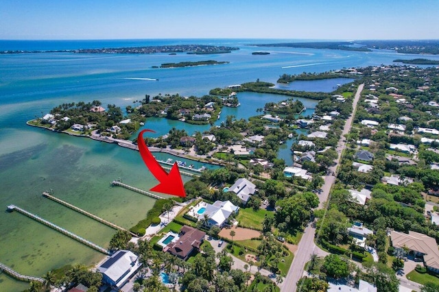 birds eye view of property featuring a water view