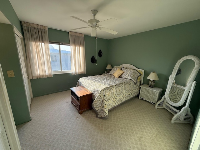 carpeted bedroom featuring a ceiling fan