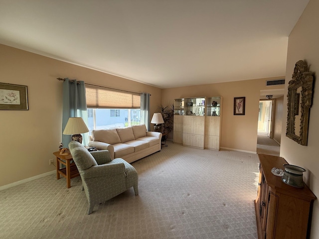 carpeted living room with visible vents and baseboards