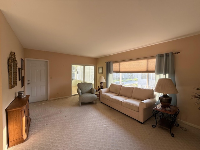 living room with light carpet and baseboards