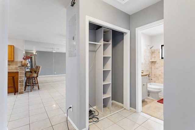 bathroom with tile patterned flooring,  shower combination, toilet, and vanity