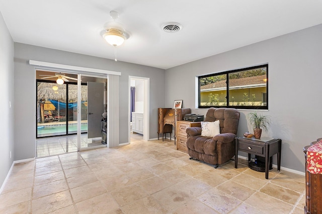 living area with visible vents and baseboards