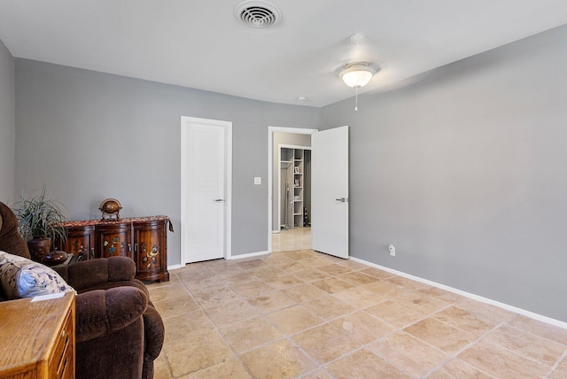 sitting room featuring baseboards and visible vents