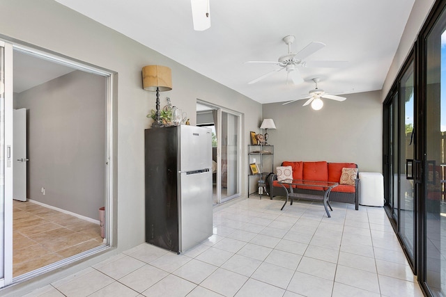 kitchen featuring light tile patterned floors and freestanding refrigerator