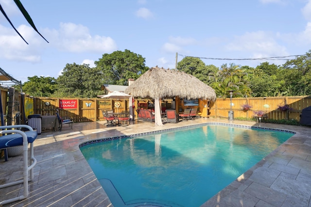 view of swimming pool featuring a gazebo, a patio, a fenced backyard, and a fenced in pool