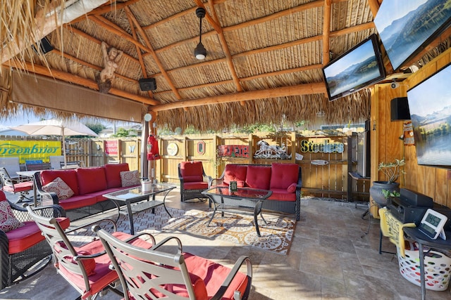 view of patio with outdoor lounge area and a gazebo