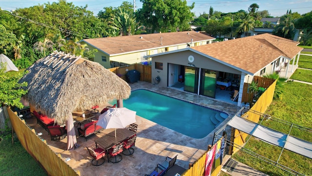 view of pool with a fenced backyard, a fenced in pool, outdoor dining area, and a patio