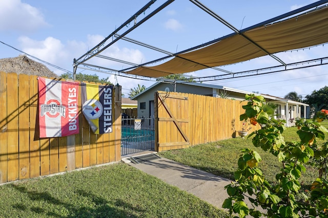 exterior space featuring fence and a gate