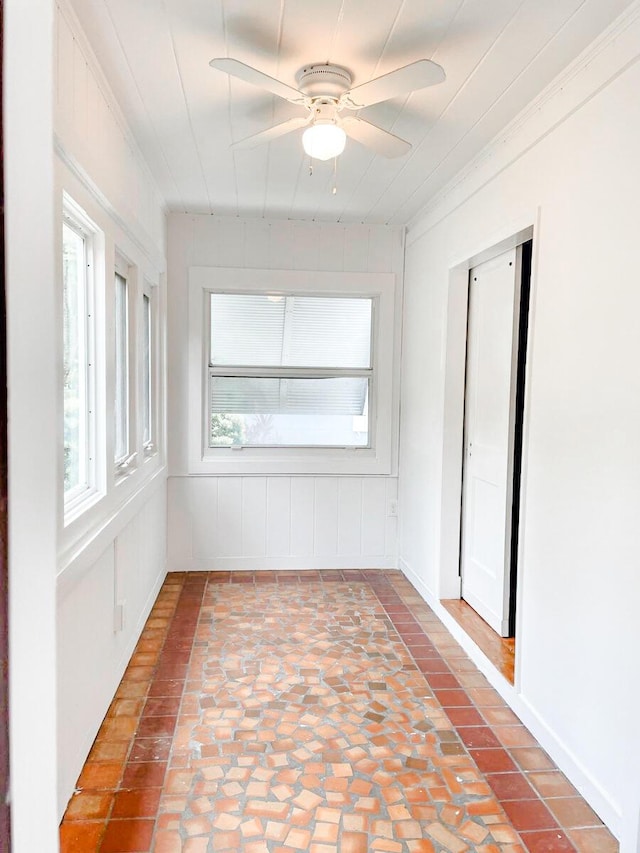 unfurnished room with a ceiling fan