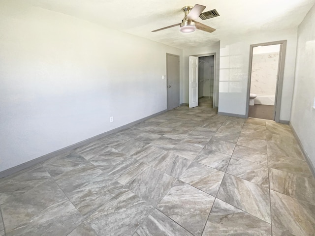 unfurnished bedroom with visible vents, ensuite bathroom, a closet, baseboards, and ceiling fan