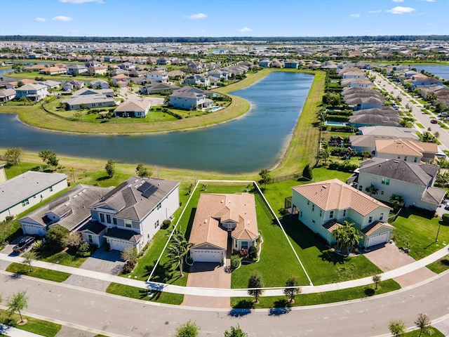 aerial view with a residential view and a water view