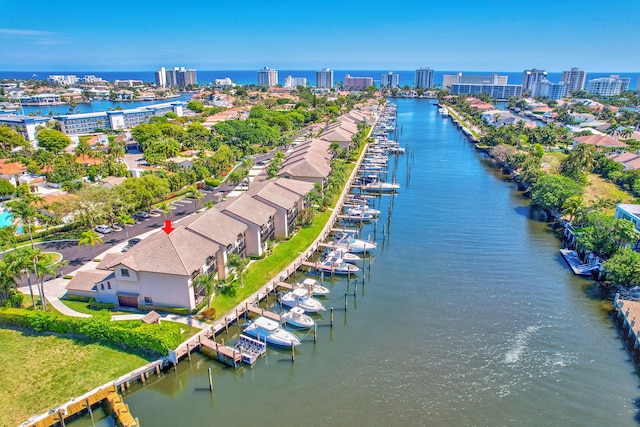 birds eye view of property featuring a view of city and a water view