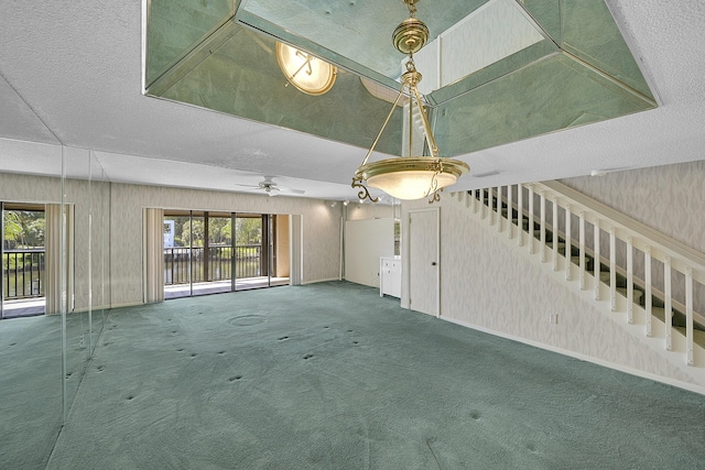 spare room with stairway, baseboards, and carpet flooring