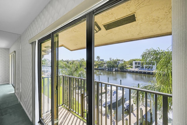 balcony featuring a water view