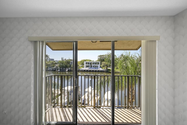 balcony featuring a water view