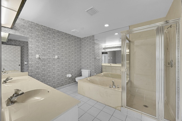 full bath with visible vents, a sink, a shower stall, tile patterned flooring, and double vanity