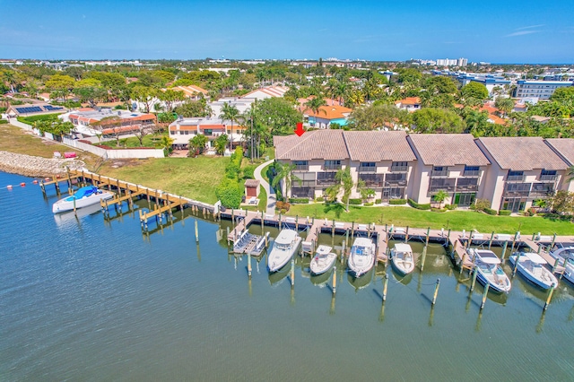 birds eye view of property with a water view and a residential view