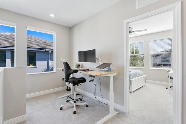 home office featuring carpet flooring, visible vents, and baseboards