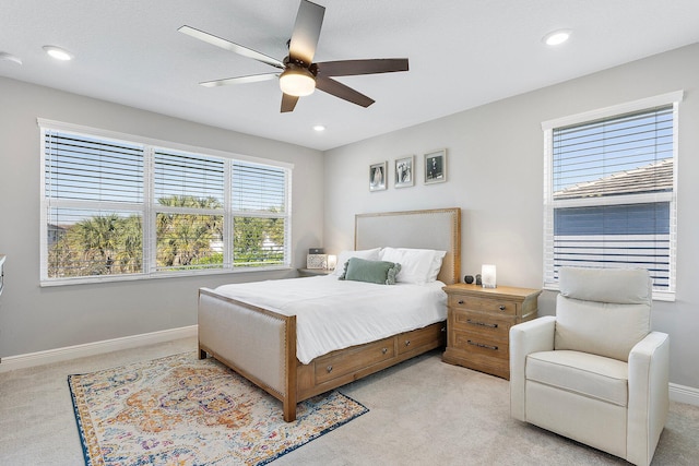 bedroom with recessed lighting, baseboards, light colored carpet, and ceiling fan