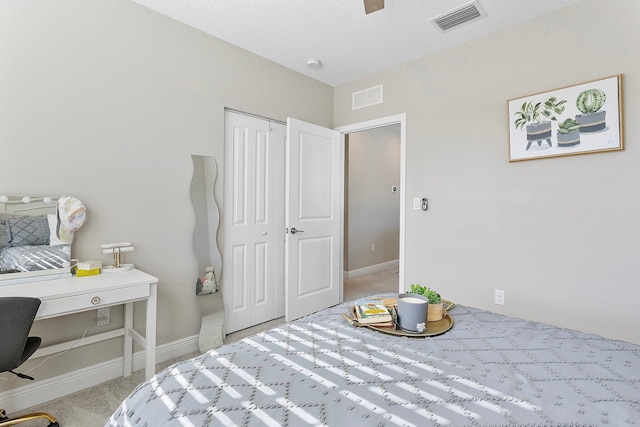 bedroom featuring visible vents, carpet flooring, and baseboards