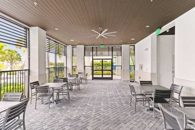 view of patio featuring outdoor dining area and ceiling fan