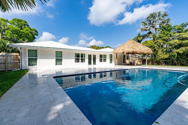 view of pool with a fenced in pool, a patio, and fence