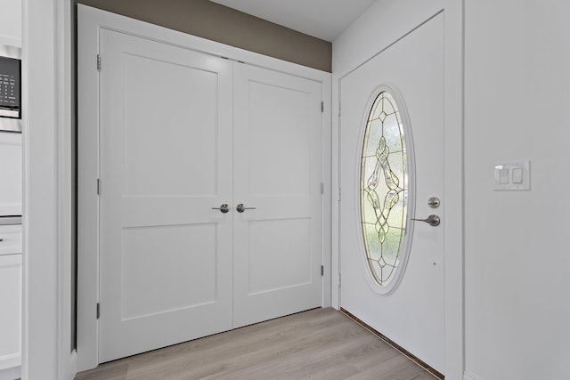 foyer entrance featuring light wood-type flooring