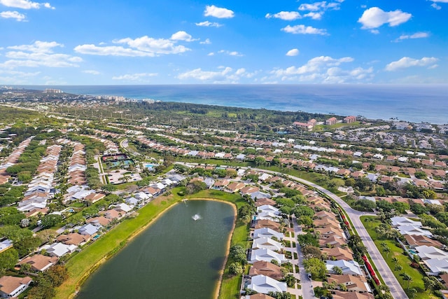 bird's eye view with a residential view and a water view