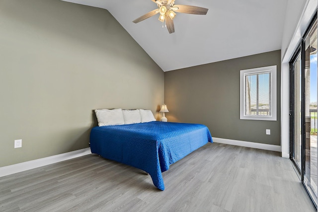 bedroom featuring light wood finished floors, high vaulted ceiling, a ceiling fan, and baseboards